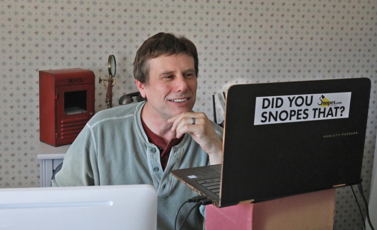 FILE - This Sept. 25, 2018 file photo shows David Mikkelson, founder of Snopes, the site that tracks fakery on the web, in his home office in Tacoma, Wash. The co-founder, CEO and a major shareholder of the fact-checking site admitted to plagiarizing from dozens of articles done by mainstream news outlets over several years, calling the appropriations "serious lapses in judgment." From 2015 to 2019, and possibly even earlier, Mikkelson included material lifted from the Los Angeles Times, The Guardian and others to scoop up web traffic, according to BuzzFeed News, which broke the story Friday, Aug. 13, 2021.