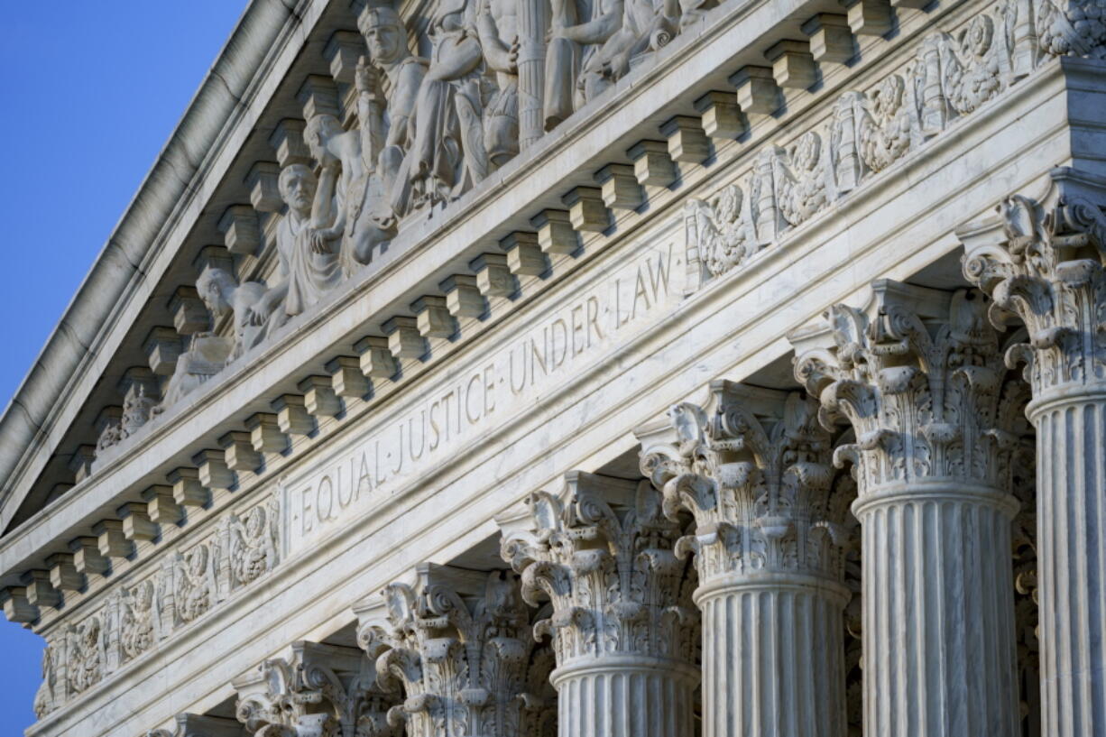 FILE - In this June 30, 2021, file photo the Supreme Court is seen in Washington.  The Supreme Court is being asked to block a plan by Indiana University to require students and employees to get vaccinated against COVID-19. It's the first time the high court has been asked to weigh in on a vaccine mandate and comes as some corporations, states and cities are also weighing vaccine requirements for workers or even to dine indoors.  (AP Photo/J.