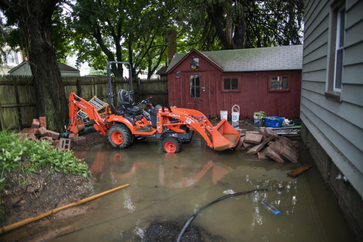 The back yard of a house is seen partially flooded during the passing of Tropical Storm Henri in Helmetta, N.J., Monday, Aug. 23, 2021.