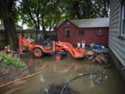 The back yard of a house is seen partially flooded during the passing of Tropical Storm Henri in Helmetta, N.J., Monday, Aug. 23, 2021.