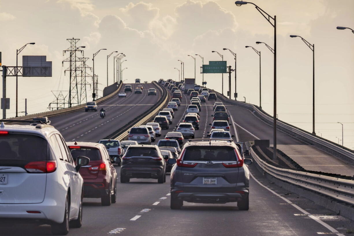 Vehicles head slowly east on the Interstate-10 twin spans leaving New Orleans while only a trickle of cars heads west back into the city before landfall of Hurricane Ida in New Orleans, Saturday, Aug. 28, 2021.