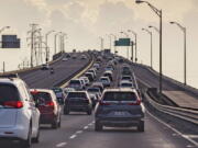 Vehicles head slowly east on the Interstate-10 twin spans leaving New Orleans while only a trickle of cars heads west back into the city before landfall of Hurricane Ida in New Orleans, Saturday, Aug. 28, 2021.