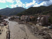 An aerial view of the city center in Bozkurt town of Kastamonu province, Turkey, Sunday, Aug. 15, 2021, after flooding. Turkey sent ships to help evacuate people and vehicles from a northern town on the Black Sea that was hard hit by flooding, as the death toll in the disaster rose Sunday to at least 62 and more people than that remained missing.