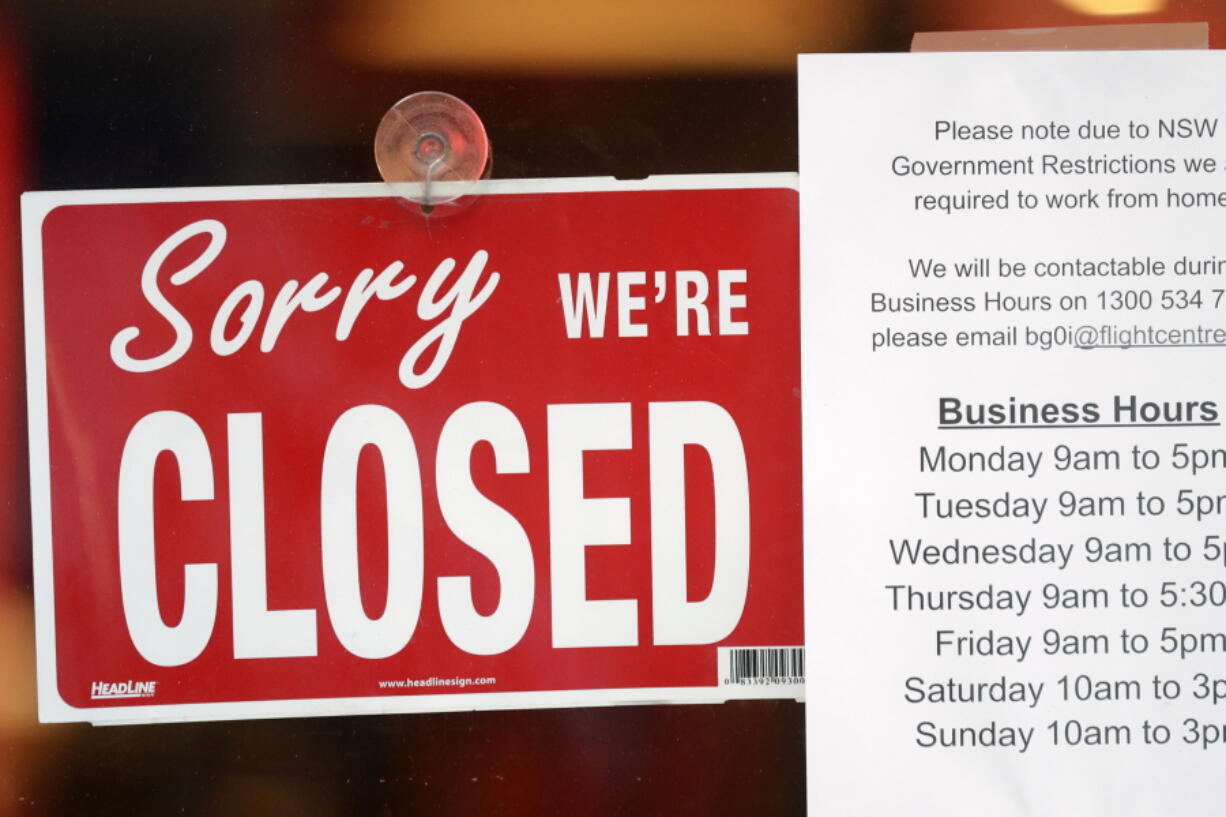 A commercial business is closed in Sydney on Aug. 13, 2021, as greater Sydney continues a weeks-long COVID-19 lockdown. Japan, Australia and New Zealand all got through the first year of the coronavirus pandemic in relatively good shape, but now are taking very divergent paths in dealing with new outbreaks of the fast-spreading delta variant.