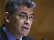 FILE - In this June 10, 2021, file photo Health and Human Services Secretary Xavier Becerra testifies before the Senate Finance Committee on President Joe Biden's budget request, at the Capitol in Washington. The federal Health and Human Services Department is requiring employees who provide care or services for patients to get their COVID-19 shots, officials announced Thursday, Aug. 12. The order from Becerra will affect more than 25,000 clinicians, researchers, contractors, trainees and volunteers with the National Institutes of Health, the Indian Health Service, and the U.S. Public Health Service Commissioned Corps. (AP Photo/J.