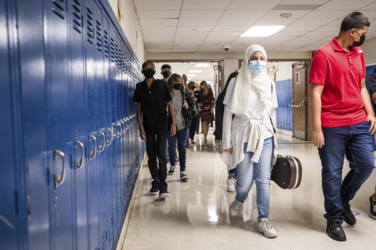 Students make their way to their classes on the first day of school Monday, Aug. 16, 2021, at Wedgwood Middle School in Fort Worth, Texas.