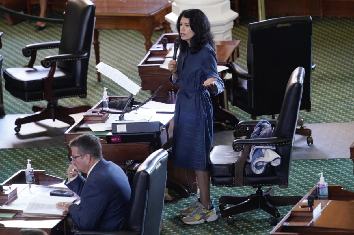 Texas State Sen. Carol Alvarado, D-Houston, wears running shoes as she filibusters Senate Bill 1, a voting bill, at the Texas Capitol Wednesday, Aug. 11, 2021, in Austin, Texas.