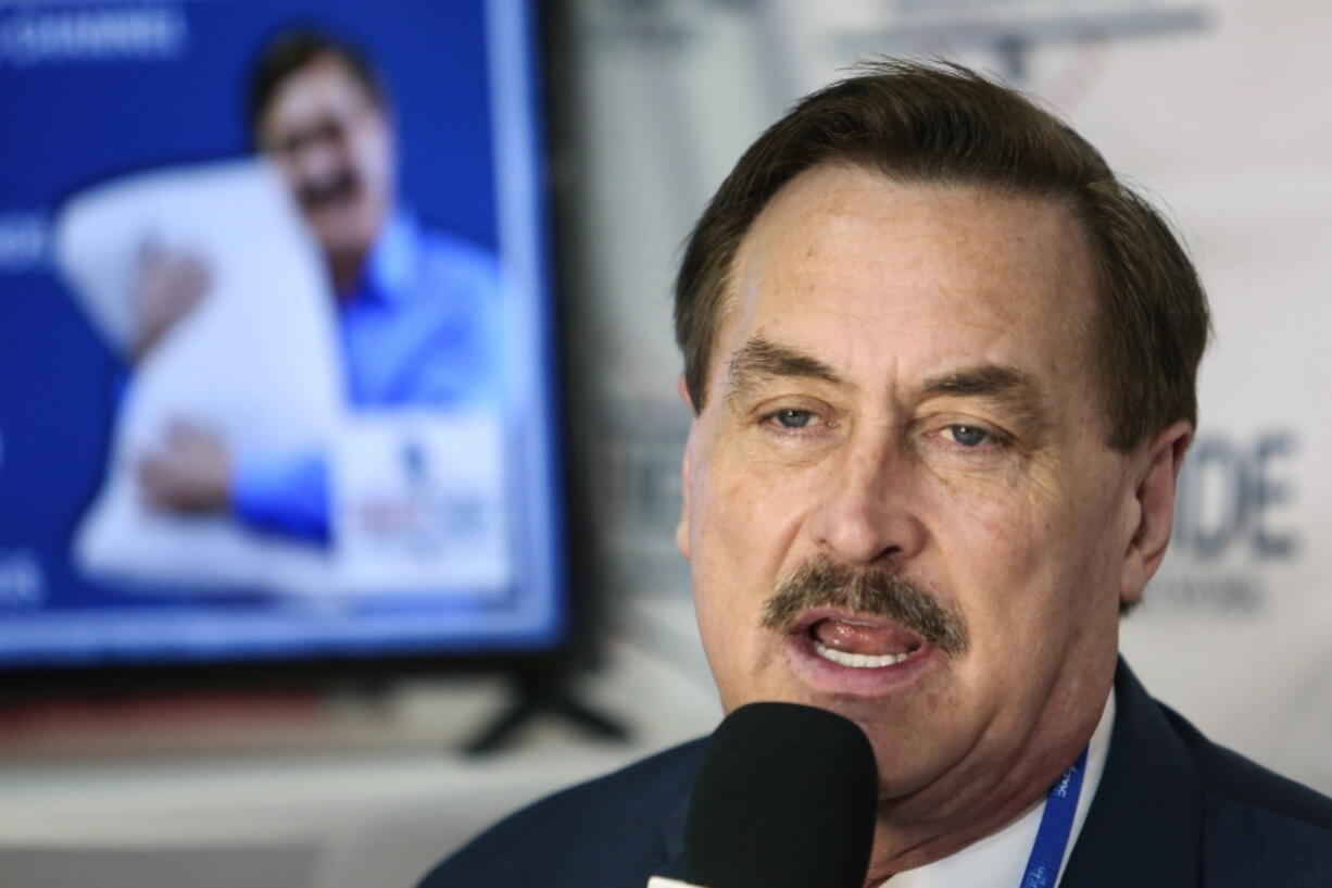 FILE - Founder and CEO of MyPillow Mike Lindell gives an interview with Right Side Broadcasting Network at the Conservative Political Action Conference in Orlando, Fla., on Feb. 28, 2021. A federal judge cleared the way Wednesday, Aug. 11 for a defamation case by Dominion Voting Systems to proceed against Trump allies Lindell, Sidney Powell and Rudy Giuliani, who had all falsely accused the company of rigging the 2020 presidential election. U.S. District Judge Carl Nichols handed down a ruling Wednesday that found there was no blanket protection on political speech.