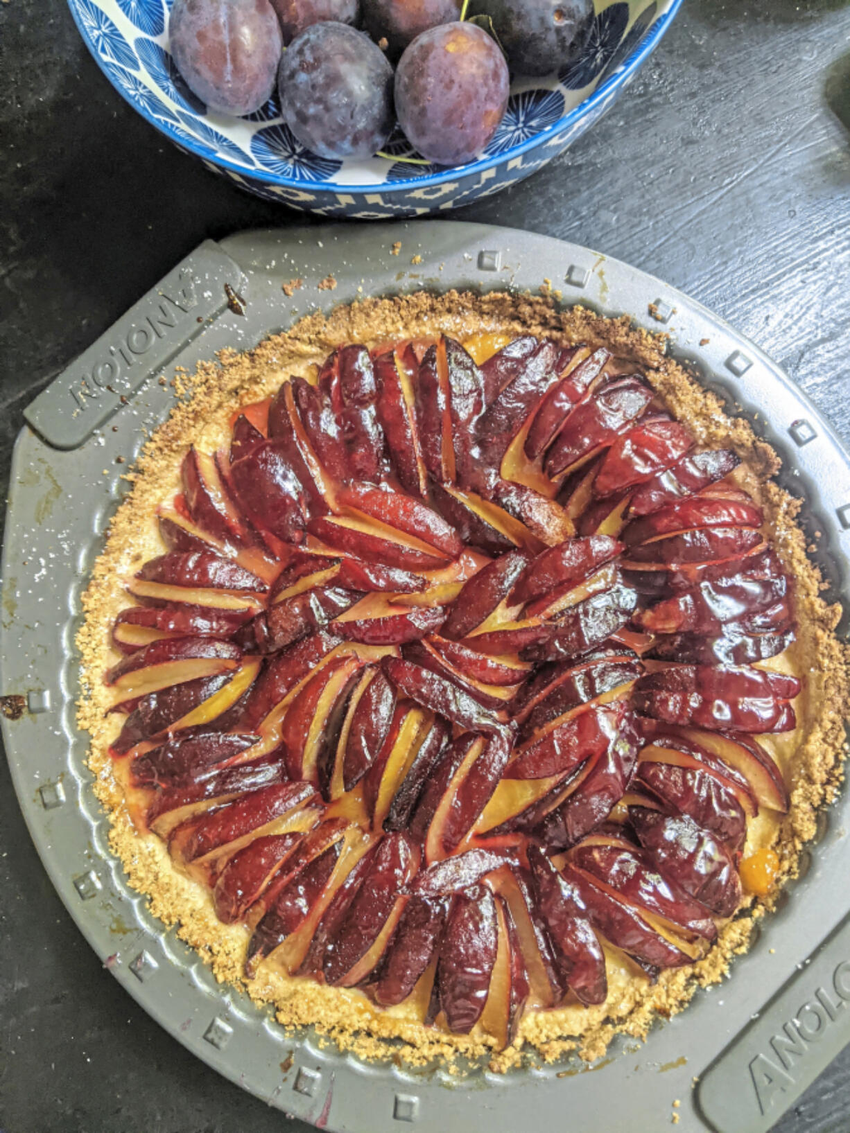 Italian prune plums are the start of this tart built on a lemon shortbread crust.