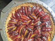 Italian prune plums are the start of this tart built on a lemon shortbread crust.