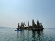 A small island on the north end of Waldo Lake is one of the few things clearly visible on the smoky afternoon of August 15, 2021.