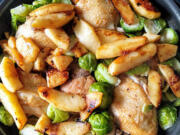 Chicken thighs braised in hard cider with Brussels sprouts and apples makes an easy one-pan fall dinner.