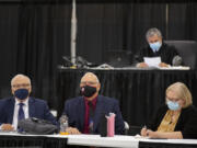 Plaintiffs Don Benton, foreground from left, Christopher Clifford and Susan Rice join Judge Gregory Gonzales, background top, as they gather for closing arguments at the Clark County Event Center at the Fairgrounds on May 17.