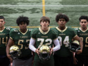 From left, junior Carlos Churape, sophomore Steve Canda III, sophomore Fox Crader, junior Koby Kast and senior David Kailea pose for a portrait at a practice on Wednesday, Sept. 15, 2021, at McKenzie Stadium.