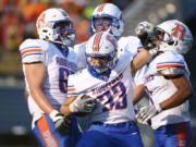 Ridgefield Spudders Davis Pankow (33) celebrates a first half score with teammates in the first half against the Hockinson Hawks in the 2A Greater St. Helens League season opener for both teams at Hockinson High School on Friday, Sept. 17, 2021. (Randy L.