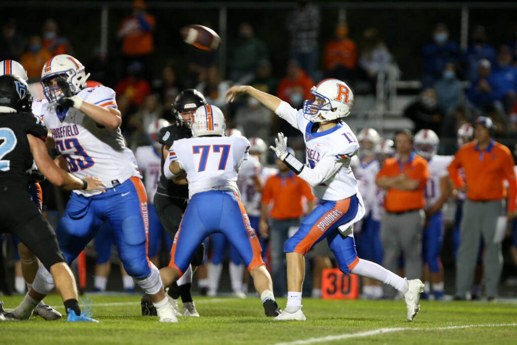 Ridgefield Spudders quarterback Brayden Malella (11) in first-half action against the Hockinson Hawks in the 2A Greater St. Helens League season opener for both teams at Hockinson High School on Friday, Sept. 17, 2021. (Randy L.