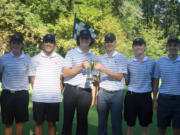 Easton Rheaume, left, and Eli Huntington hold the Titan Cup trophy after the Camas boys golf team won the Titan Cup four-team tournament Monday at Camas Meadows.