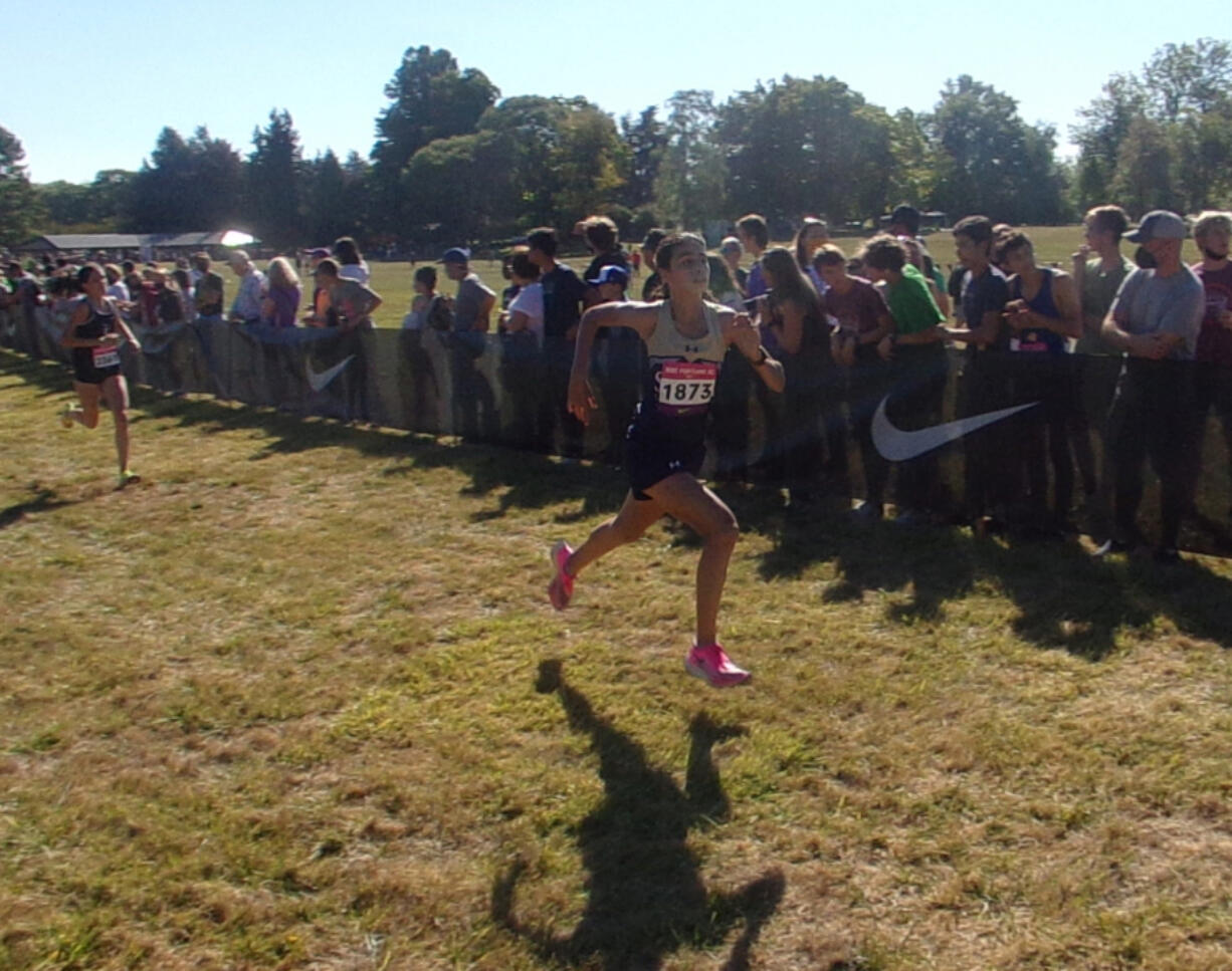 Seton Catholic's Alexis Leone sprints to the finish of the Danner girls championship race at Nike Portland XC meet at Blue Lake Park in Fairview, Ore., on Saturday.