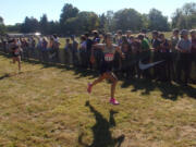 Seton Catholic's Alexis Leone sprints to the finish of the Danner girls championship race at Nike Portland XC meet at Blue Lake Park in Fairview, Ore., on Saturday.