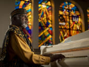 Pastor T.L. Barrett, a Pentecostal minister and a gospel musician, at the piano Sept. 14, in his church, Life Center COGIC, in Chicago's Washington Park neighborhood.