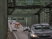 A truck joins other traffic crossing the Interstate 5 Bridge while traveling north on I-5 on Jan. 7, 2020.