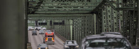 A truck joins other traffic crossing the Interstate 5 Bridge while traveling north on I-5 on Jan. 7, 2020.