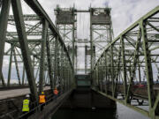 Visitors take a tour of the Interstate 5 Bridge. The older of the two spans opened in 1917, with the newer span following in 1958.