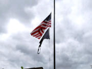 The U.S. flag is displayed at half staff on a home's flagpole recently following the Aug. 24 death of longtime Scouting volunteer Greg Hamilton at the age of 65.