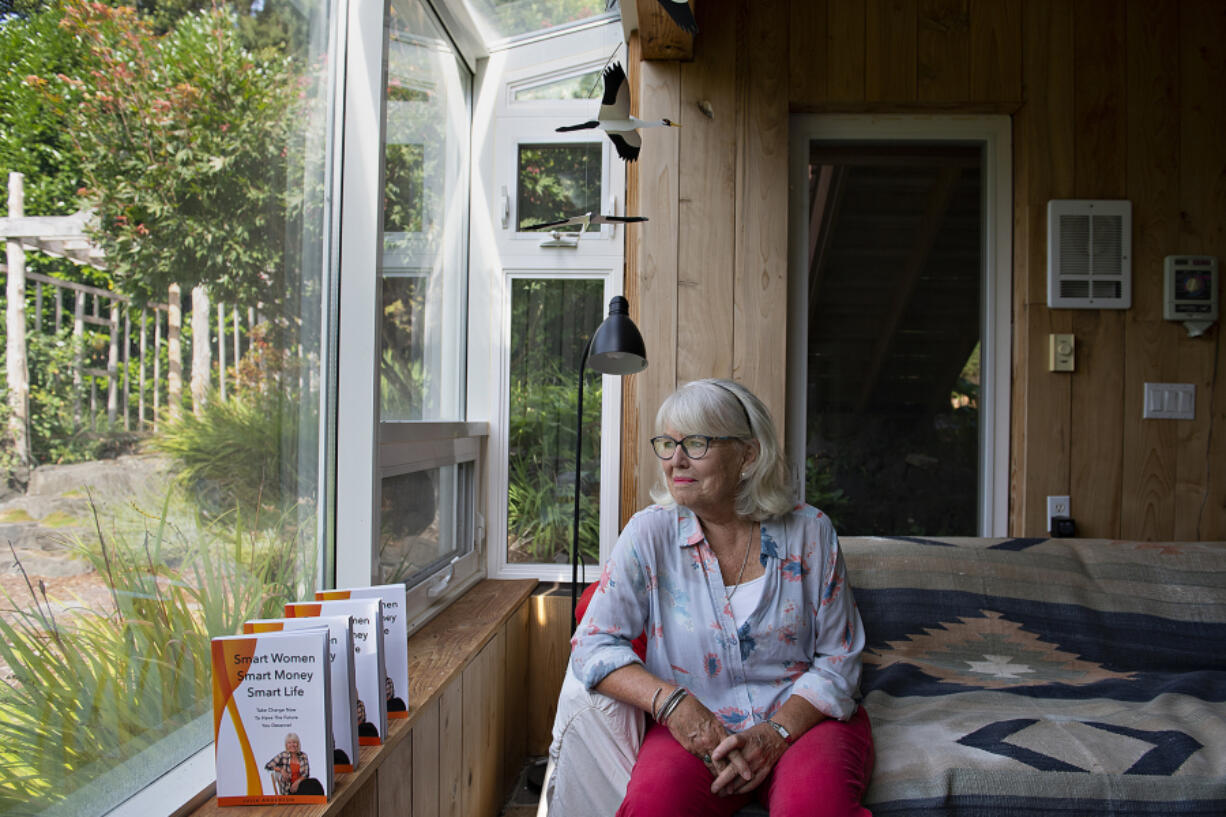 Julia Anderson, seen at her home east of Woodland, has spent her retirement writing and speaking to convince women to become more confident investors.