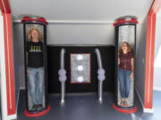 Kirby, left, and Patricia Swatosh stand in "freezing tubes" styled after those found in the TV show "Lost in Space" on Monday in their UFO-themed Airbnb in Brush Prairie.
