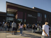 Parents and students mask up as they gather for the first day of classes at Marrion Elementary School on Aug. 31.