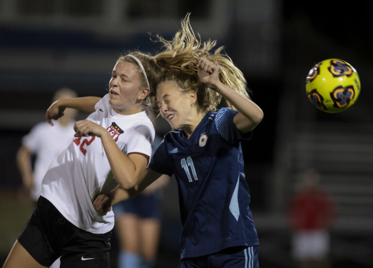 Camas junior Anna Mooney wins a header over Hockinson sophomore Ani Vossler in a nonleague girls soccer game Tuesday, Sept. 7, 2021, at Hockinson High School. Camas won 3-1.