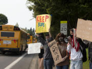 Skyview High School students including junior Clara Hawkins, 16, in gray from left, junior Ariel Tanner, 16, senior Dylan Walker, 18, and senior Elliott Gibby, 17, show their support for masks in school Tuesday afternoon.