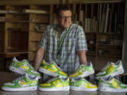 King's Way Christian Schools art teacher Justin Tigner, a professional sports artist, is traveling with the University of Oregon football team this fall as its game-day artist doing hand-painted shoe designs. Tigner also designs custom shoes and cleats for clientele including NFL players. He said he plans to blend two previous designs for custom shoes, a creation to be raffled off during Oregon football's alumni and donor tailgate Saturday at Ohio State.