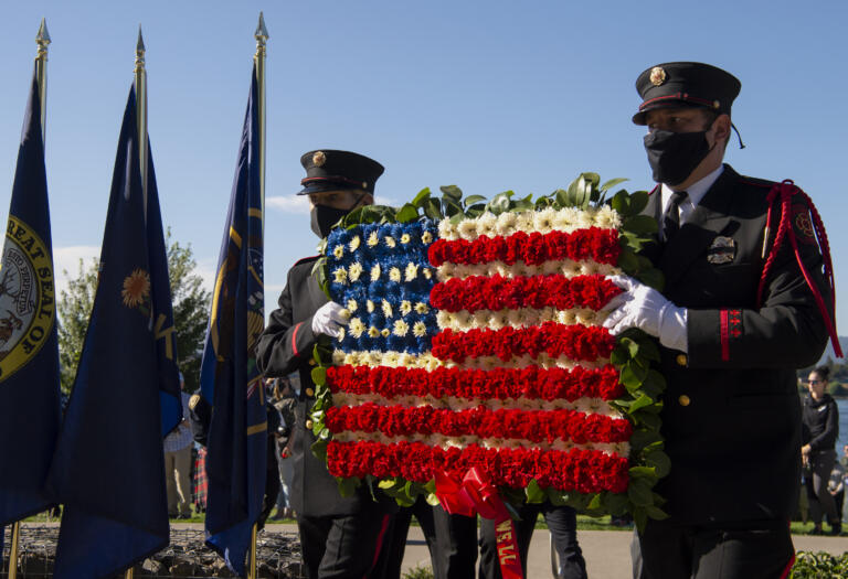 Members of the Vancouver Fire Department Honor Guard present a wreath during the 9/11 Remembrance Ceremony on Saturday, Sept. 11, 2021, at Waterfront Park in downtown Vancouver.