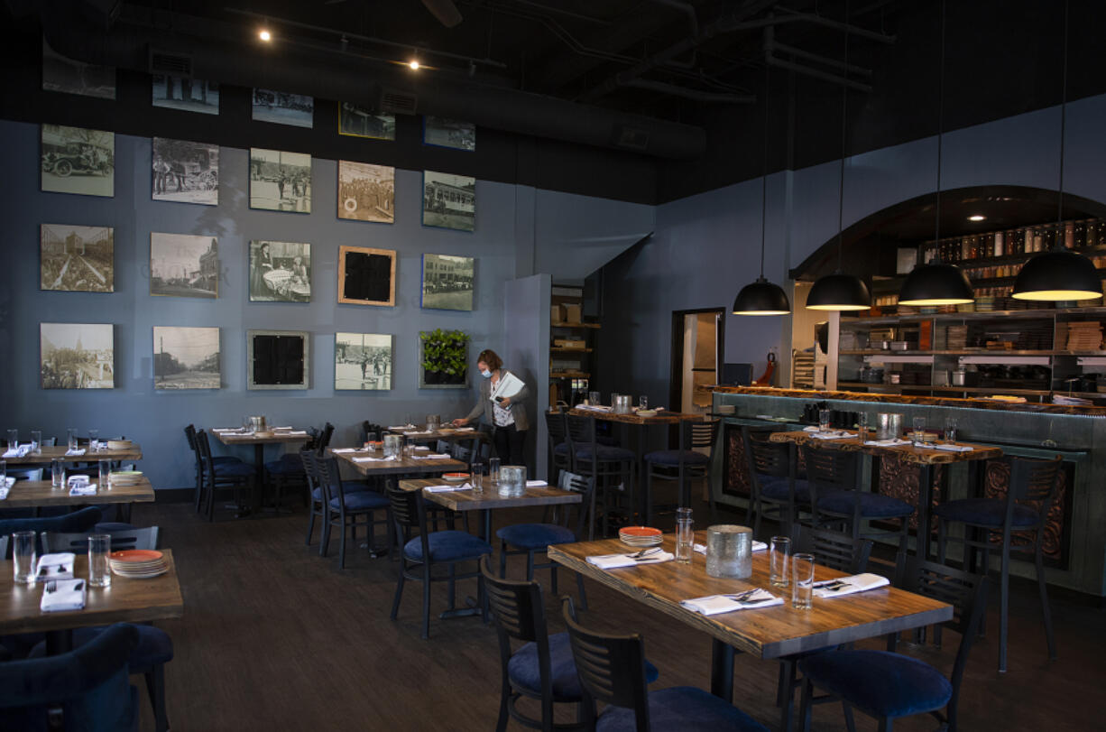 Melissa McCusker prepares for customers while working at The Sedgwick in downtown Vancouver. The new restaurant opened recently in the space previously occupied by Tommy O's.