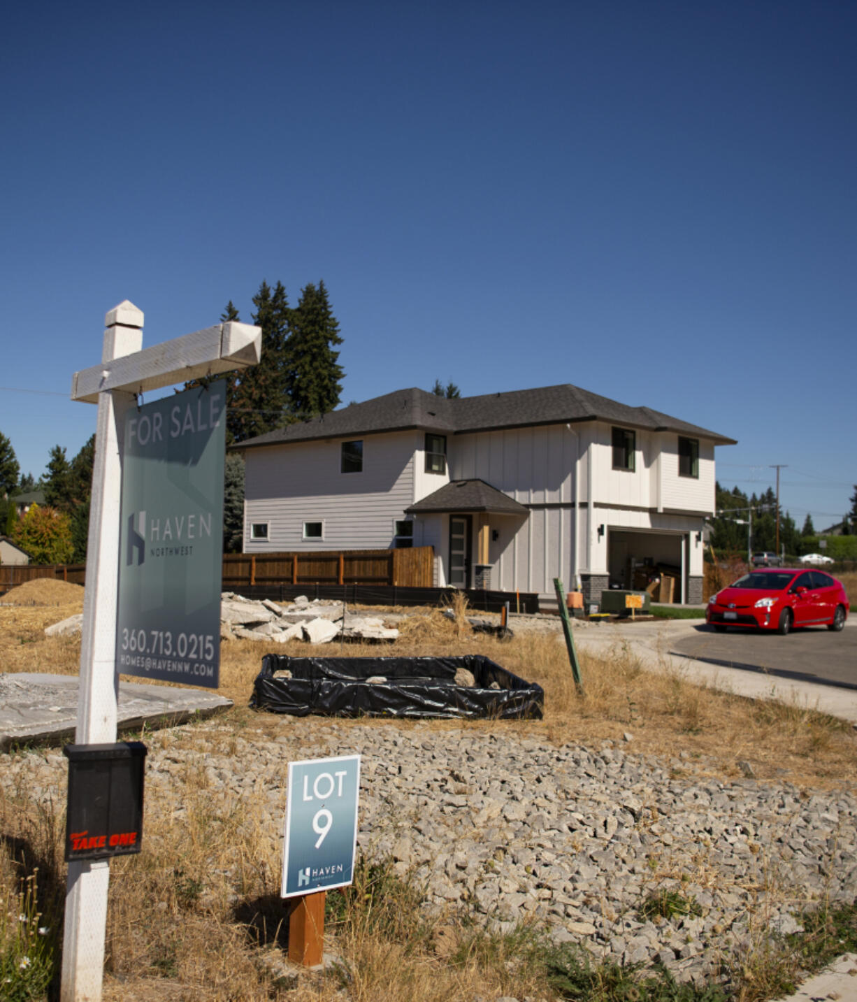 A for sale sign sits in front of a house at the Haven Northwest housing complex on Northeast 118th Street. Clark County's housing market slowed slightly this summer, but remains very hot in relative terms, with limited inventory setting off bidding wars among buyers and contributing to a steady rise in home prices.