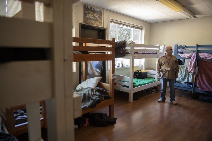 Adam Kravitz of Outsiders Inn inspects a dorm room at the St. Paul Lutheran Church in downtown Vancouver, where the nonprofit provides its services.