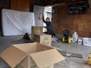 Raoul Campbell-Rouzan of Vancouver packs up his garage while gearing up for his upcoming move to Arizona on Friday morning. A record number of people are quitting their jobs during the pandemic.