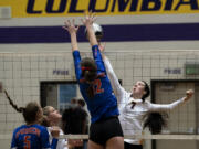 Ridgefield’s Emily Vossenkuhl, front, tries to block a tip from Columbia River’s Aaliyah Turner during a volleyball match Sept. 21 at Columbia River High School. Thursday, Columbia River avenged that earlier loss with a 3-1 win over Ridgefield to snap the Spudders' 51-match win streak.