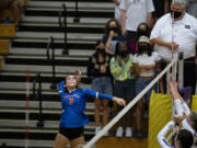 Ridgefield junior hitter Paige Stepaniuk loads up for an attack during the 2A Greater St. Helens League volleyball match on Tuesday at Columbia River High School. The Spudders won 3-0.