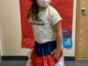 Pupils in the dual language kindergarten at Washougal are celebrating Viva la Independencia National Hispanic and Latinx Heritage Month. Selena Corona models a skirt.