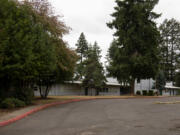 Two buildings sit on the land that Ginn Group is looking to develop. Above is the former Fir Grove Children's Center, which was recently relocated and renamed the Jim Tangeman Center; at right is a single-family home on the property that will be demolished, too. The properties are on a combined 4.44 acres at 2920 and 2902 Falk Road, near Burnt Bridge Creek Park.