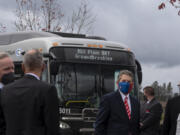 Guests wear masks as they gather near C-Tran buses at the Mill Plain Bus Rapid Transit groundbreaking event Tuesday afternoon. The $50 million project will add Clark County's second bus rapid transit line following the Vine, which debuted in 2017.