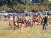 Runners in the Division I girls race take off on the course at Blue Lake Park at the Nike Portland XC meet on Saturday, Sept.