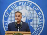 Washington Secretary of Health Umair A. Shah speaks at a news conference with Washington Gov. Jay Inslee, Wednesday, Aug. 18, 2021, at the Capitol in Olympia, Wash. Inslee announced that Washington state is expanding its vaccine mandate to include all public, charter and private school teachers and staff, as well as those working at the state's colleges and universities. Inslee also expanded the statewide indoor mask mandate in place for non-vaccinated individuals to include those who are vaccinated. (AP Photo/Ted S.