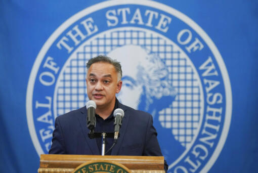 Washington Secretary of Health Umair A. Shah speaks at a news conference with Washington Gov. Jay Inslee, Wednesday, Aug. 18, 2021, at the Capitol in Olympia, Wash. Inslee announced that Washington state is expanding its vaccine mandate to include all public, charter and private school teachers and staff, as well as those working at the state's colleges and universities. Inslee also expanded the statewide indoor mask mandate in place for non-vaccinated individuals to include those who are vaccinated. (AP Photo/Ted S.