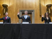 Secretary of Homeland Security Alejandro Mayorkas, left, FBI Director Christopher Wray, center, and Director of the National Counterterrorism Center Christine Abizaid, are sworn-in prior to testifying before a Senate Homeland Security and Governmental Affairs Committee hearing to discuss security threats 20 years after the 9/11 terrorist attacks, Tuesday, Sept. 21, 2021 on Capitol Hill in Washington.