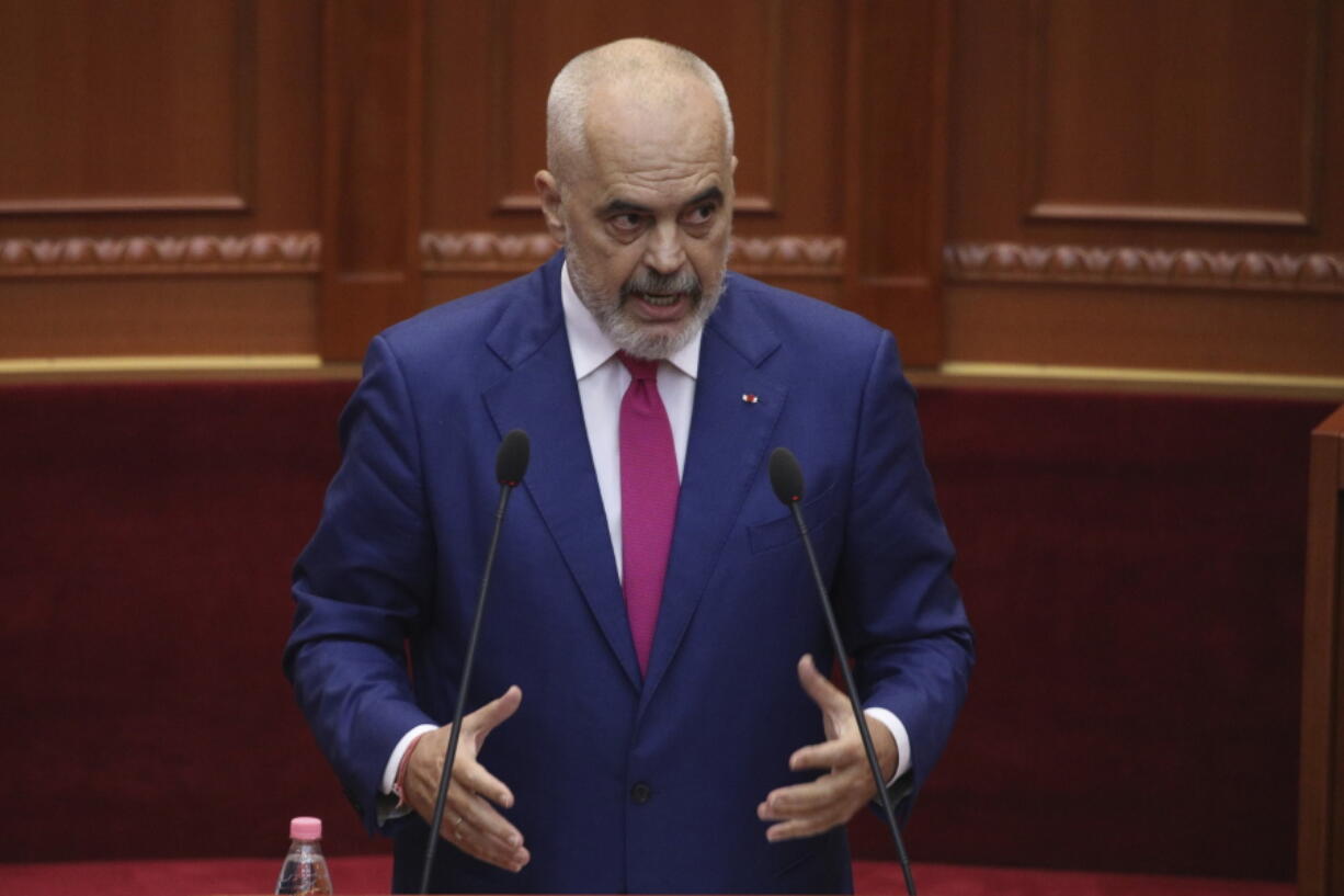 Albanian Prime Minister Edi Rama speaks during a debate at the parliament in Tirana, Albania, Thursday, Sept. 16, 2021. Albania's parliament was to vote late Thursday to approve the new, female-dominated Cabinet of Prime Minister Edi Rama, with 12 of the 17 jobs going to women, propelling Albania to the top of global rankings in terms of the percentage of women holding Cabinet positions.