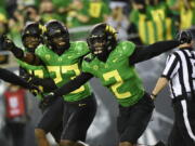 Oregon cornerback Mykael Wright (2) celebrates his interception with Oregon safety Verone McKinley III (23) during the first quarter of an NCAA college football game Saturday, Sept. 25, 2021, in Eugene, Ore.